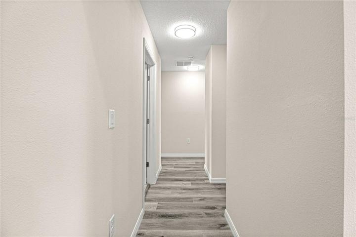 Hallway from kitchen to 3 bedrooms/2 bathrooms