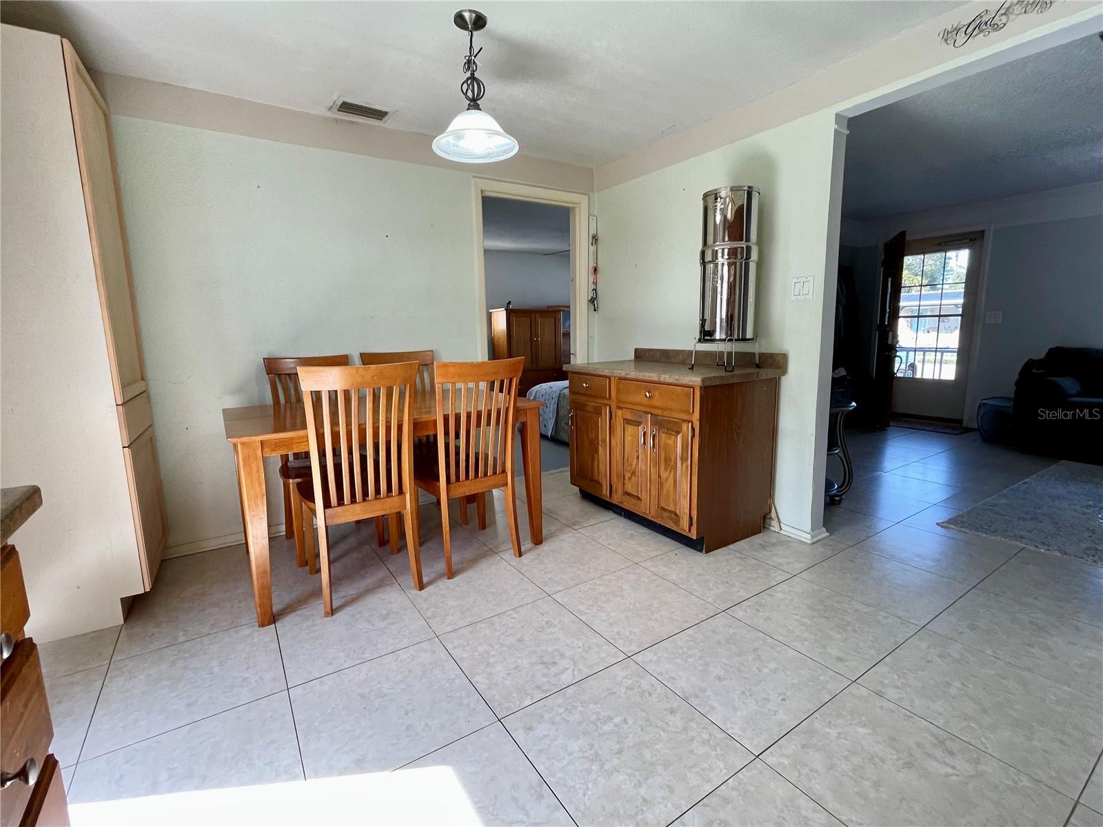 Some extra mix match cabinetry on the side of the table, but a very spacious dining space