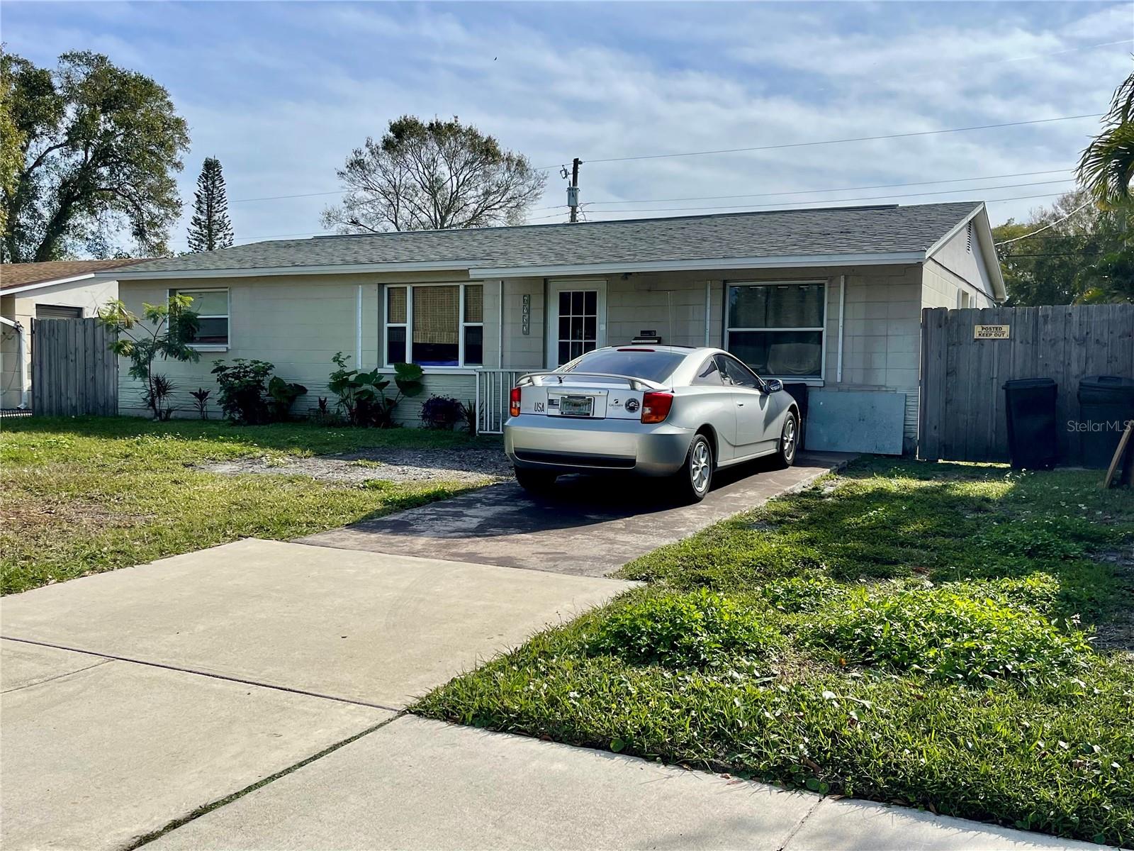 Concrete block home, featuring sidewalks