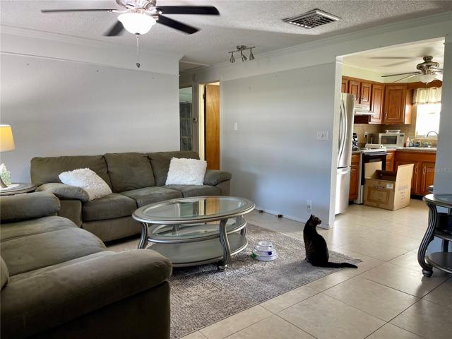Down the hall you will find the second bedroom and the primary suite