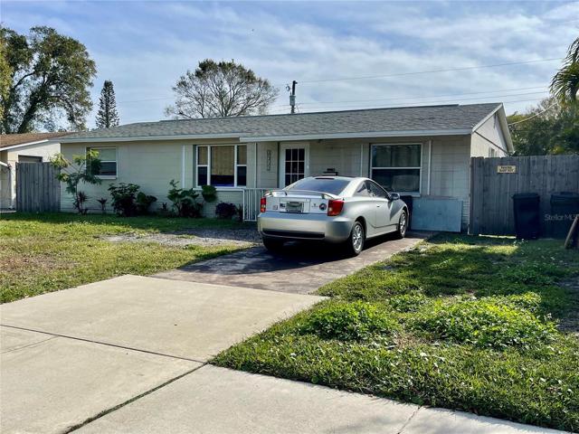 Concrete block home, featuring sidewalks