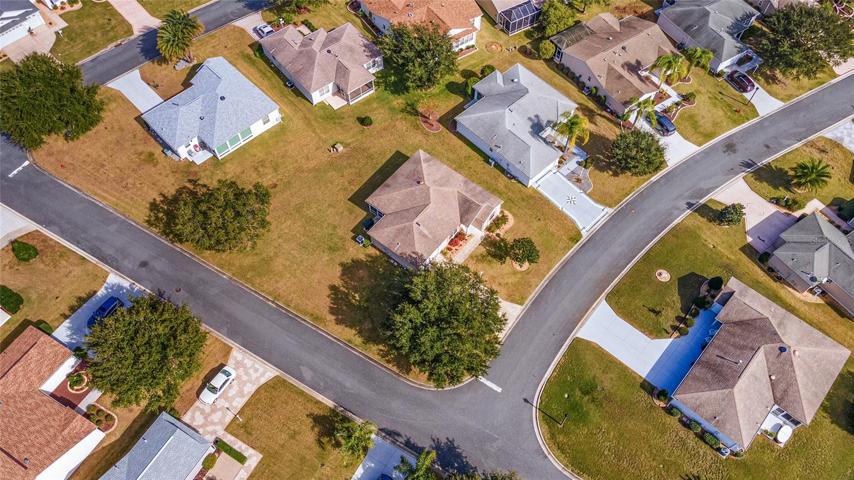 AERIAL OVERHEAD shows intersection of Lisette Way & Alora Street in VILLAGE of AMELIA