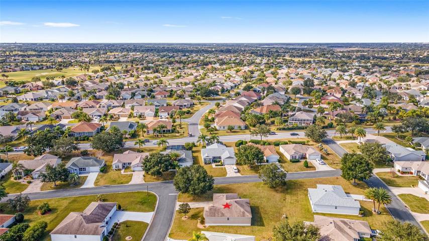 Looking WEST: Lisette Way (1st road, west side of subject property), Odell Circle (2nd road w/ painted lines), & VILLAGE of MALLORY SQUARE lies west of Odell Circle.