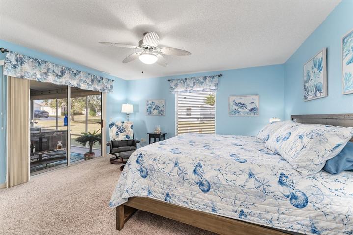 PRIMARY BEDROOM has SLIDING GLASS DOORS to ENCLOSED LANAI