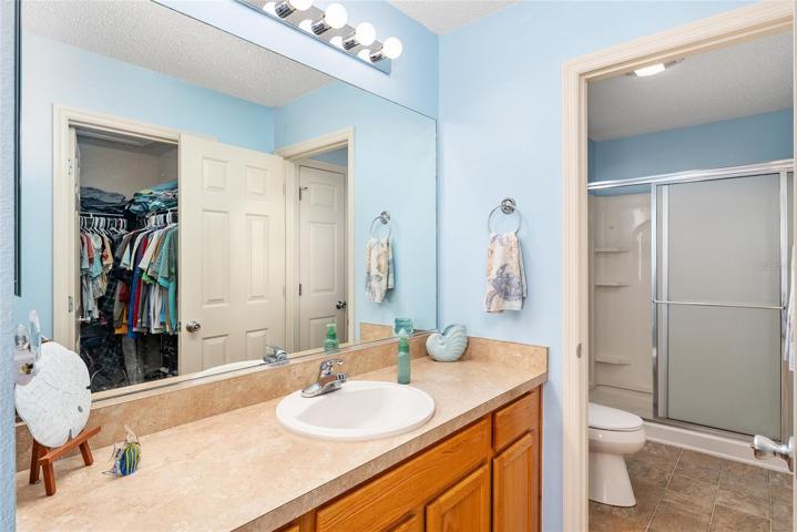 ENSUITE BATHROOM w/ view of WALK-IN SHOWER (back R)