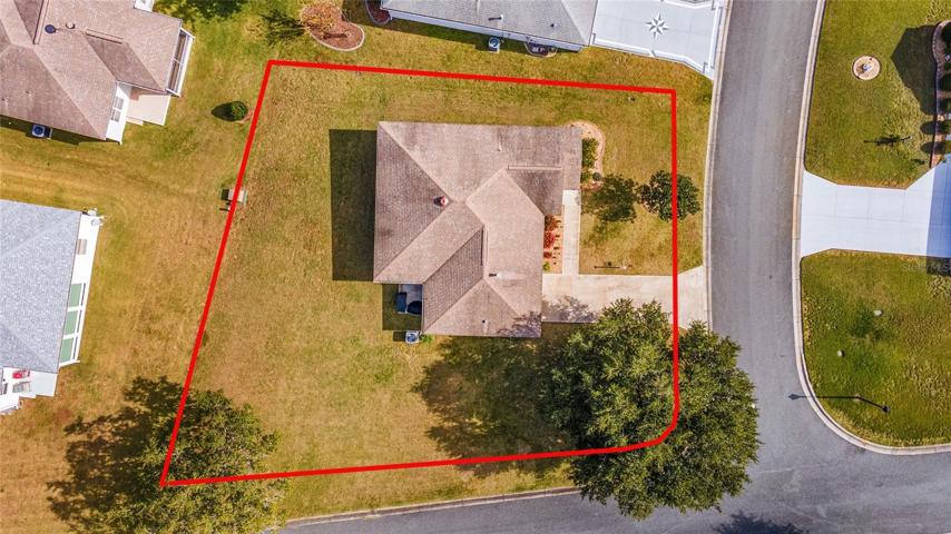 AERIAL OVERHEAD shows large CORNER LOT (0.25 acre).  Boundary lines are approximate - Buyer to verify lot measurements with survey.