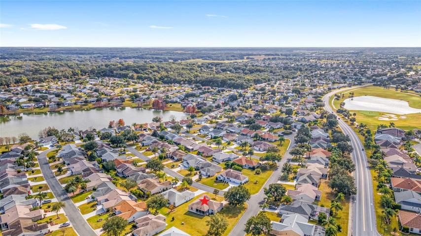 Looking SOUTHEAST: Odell Circle runs south (R), Pond on L is nestled in the VILLAGE of AMELIA. The rolling hills of Amelia are the perfect scenic spot for your daily walks!
