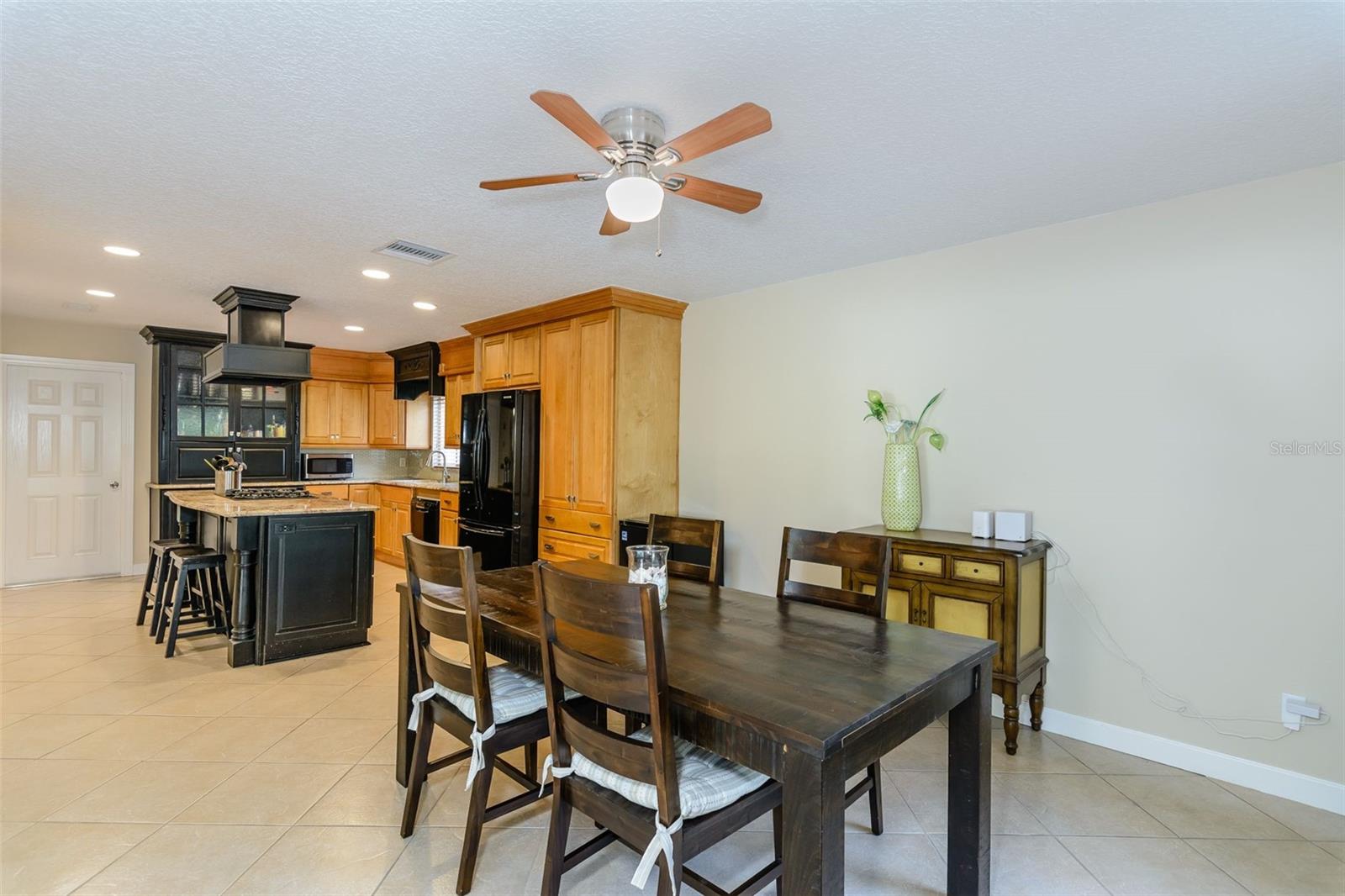 The sizable dining room has plenty of space for an eight person table.