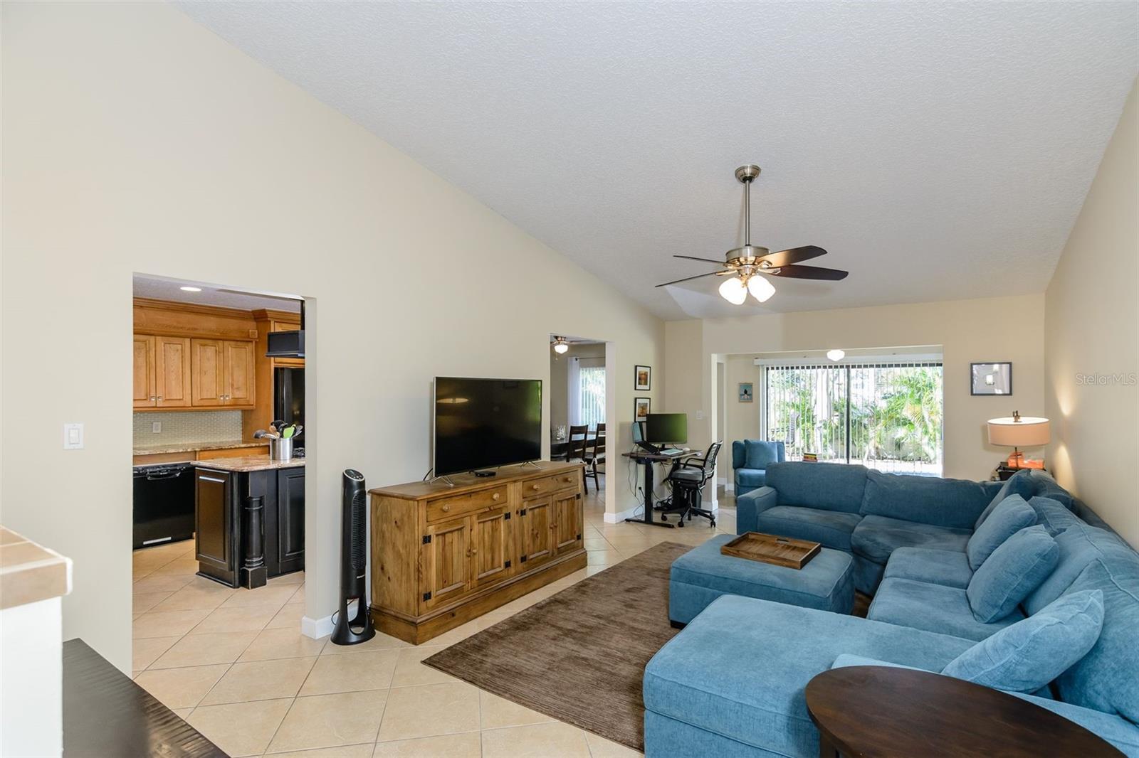 From the entrance, the living room and Florida room are straight ahead, with the kitchen and dining room to the left.