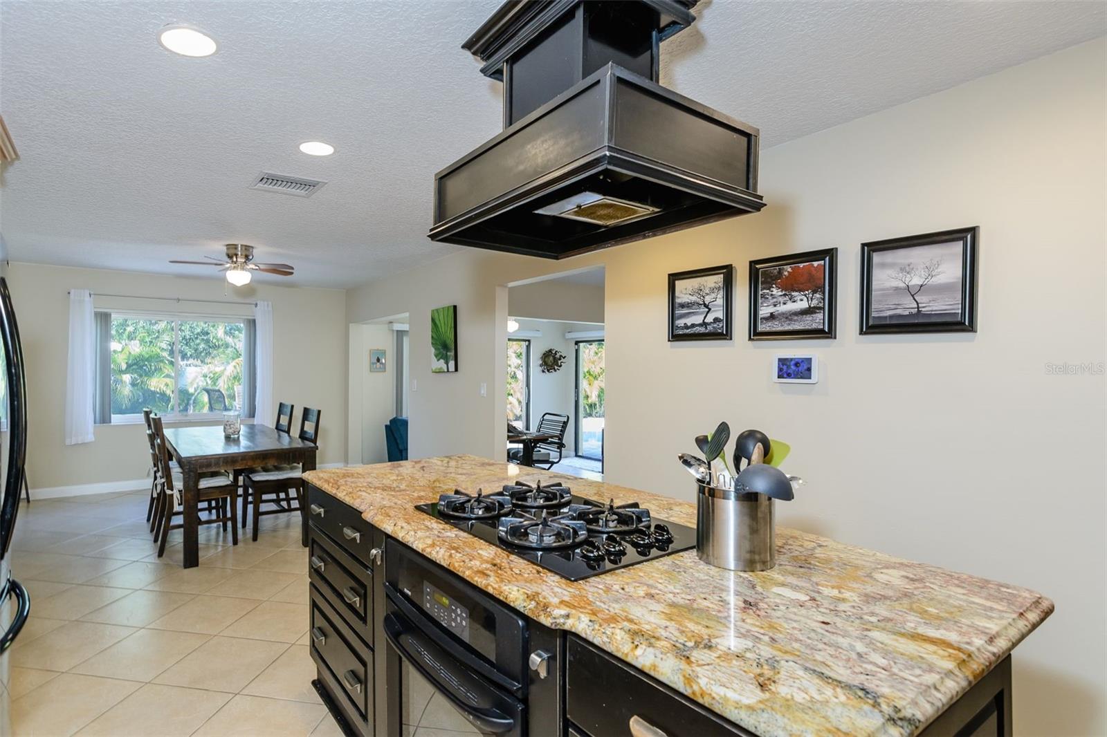 A gorgeous center island houses the gas stove.