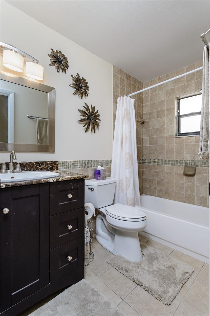 The second bathroom is updated and offers a tub with shower.