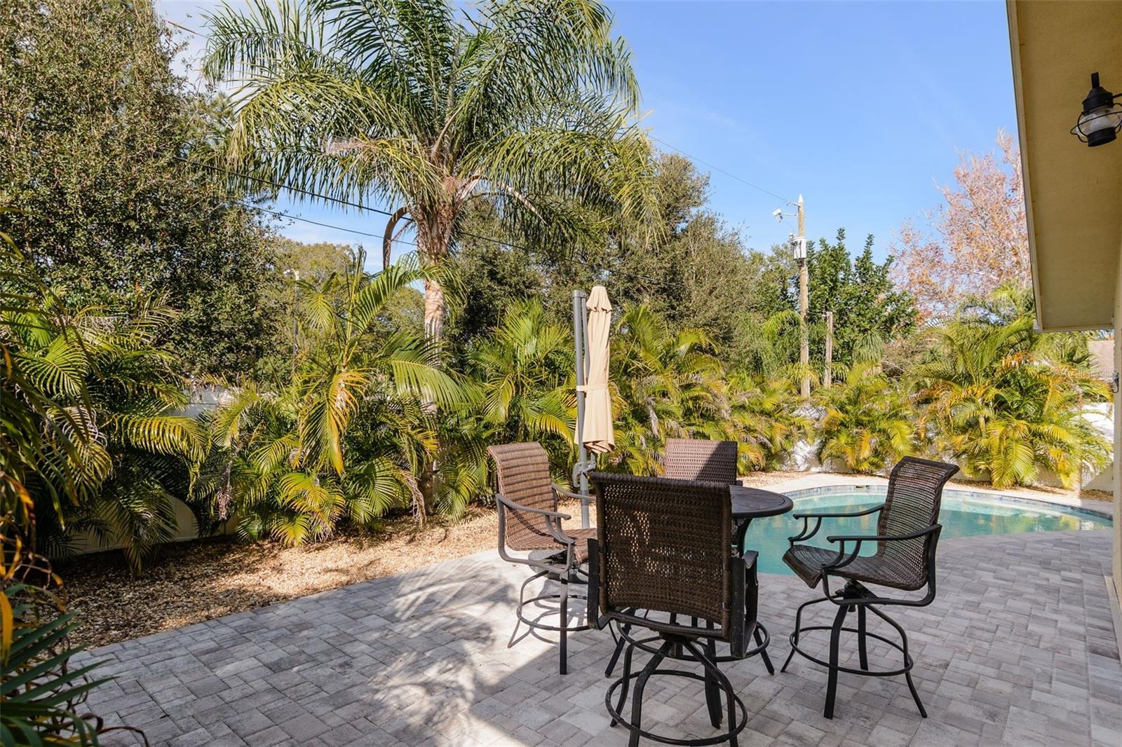 Lush, mature landscaping offers a resort-like atmosphere and added privacy.