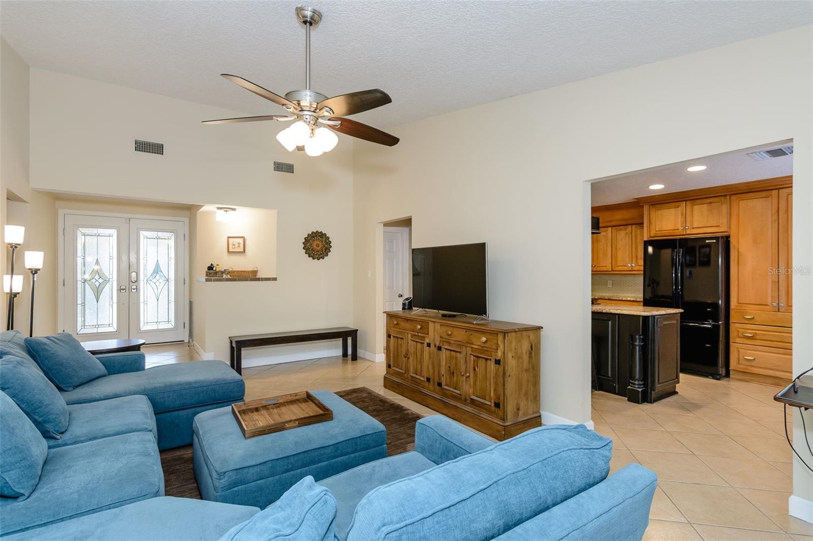 The living room and kitchen are adjacent, perfect for entertaining.