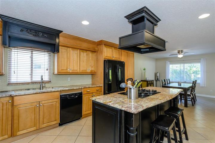 The range hood is vented to the attic.