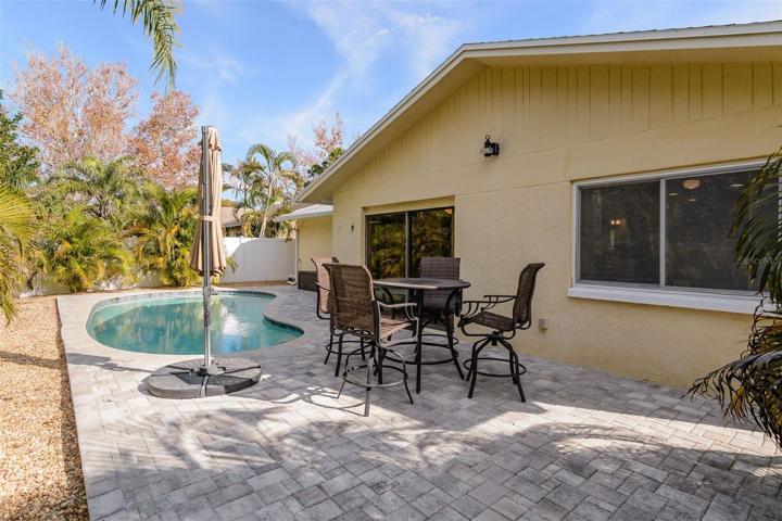 The pavered back yard is easy to maintain and has pleny of deck space for lounge chairs and/or outdoor furniture for entertaining.