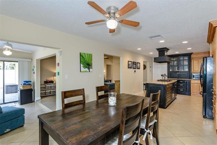 The view from the dining room shows the Florida room to the left, kitchen to the right and living room in the center.