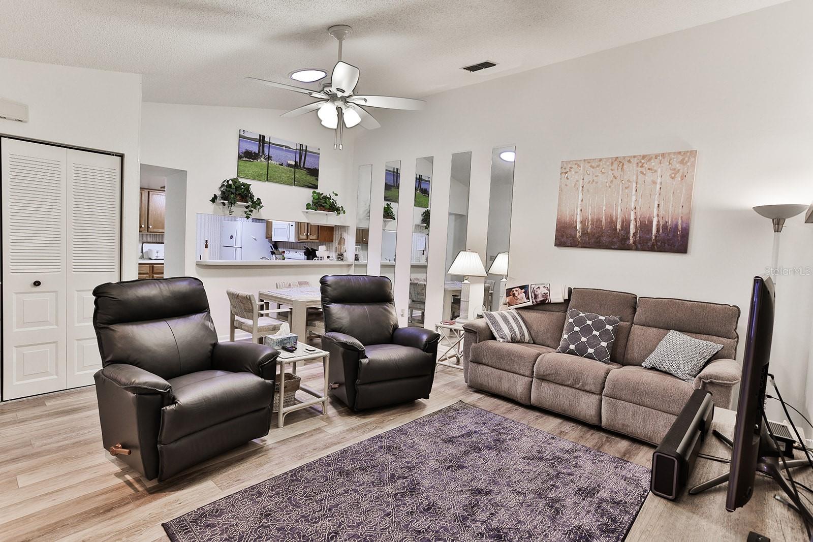 Living room with view of dining and kitchen