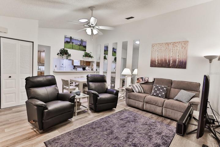 Living room with view of dining and kitchen