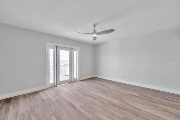 bedroom with french door that leads to balcony