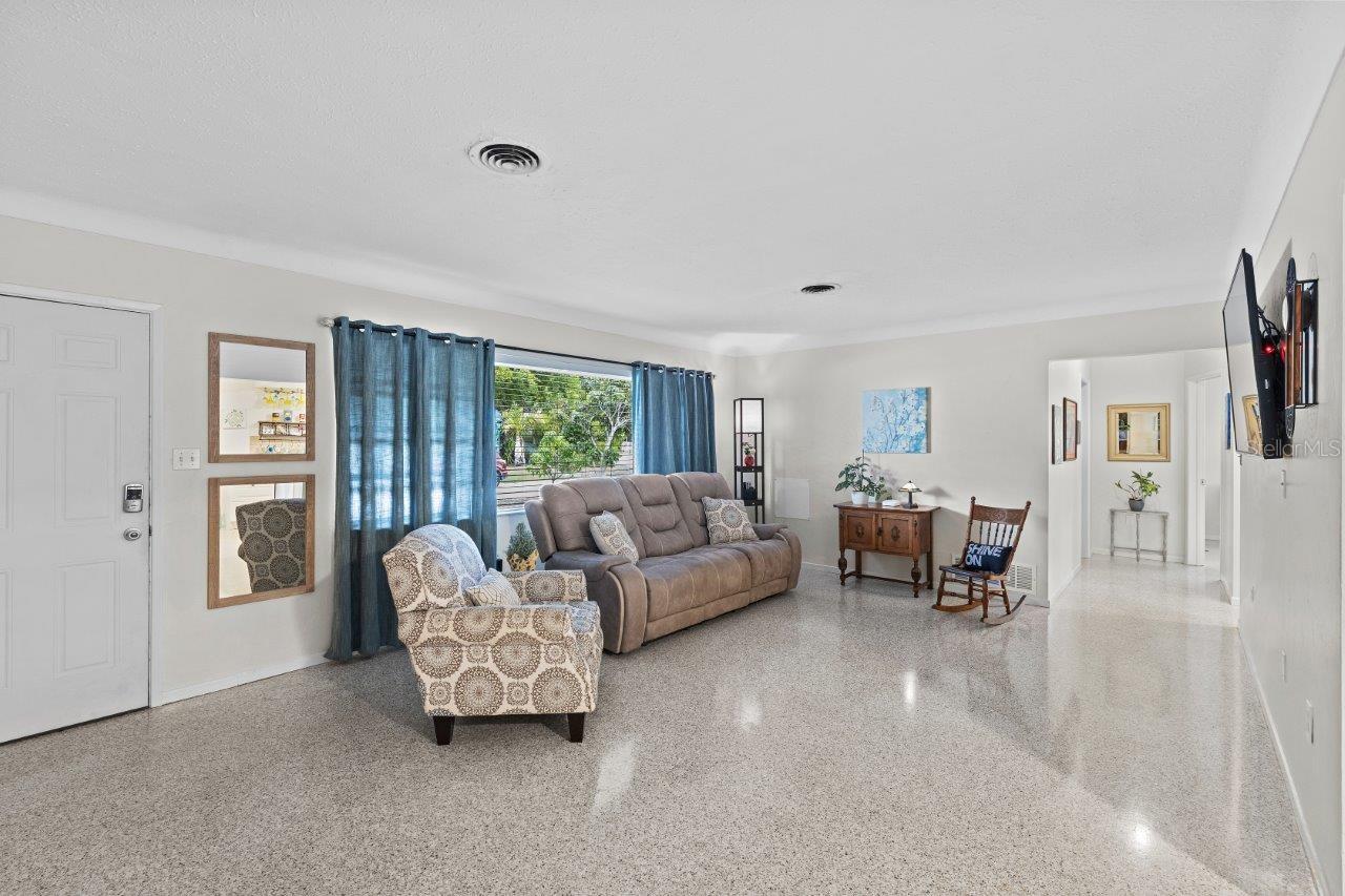 Living room featuring freshly polished terrazzo flooring.