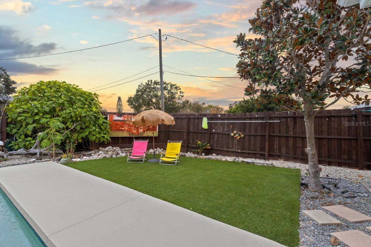 Back yard featuring artificial turf