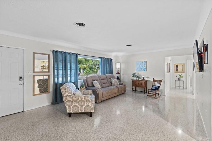 Living room featuring freshly polished terrazzo flooring.