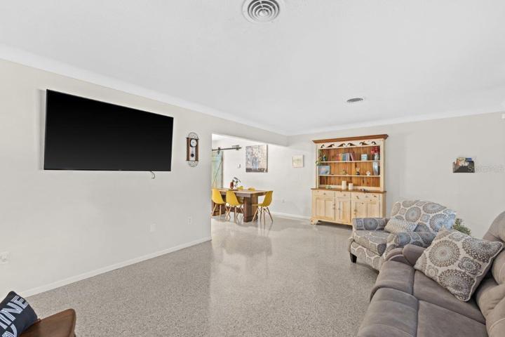 Living room featuring freshly polished terrazzo flooring.