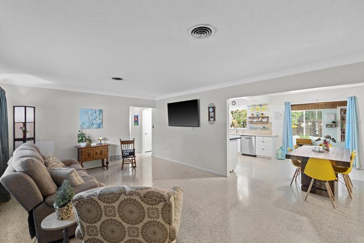 Living room featuring freshly polished terrazzo flooring.