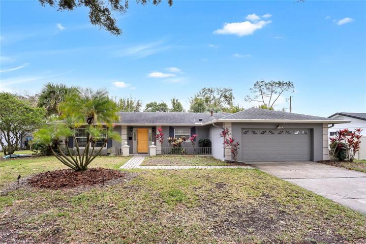 North facing ranch home with large front yard and mature oaks.