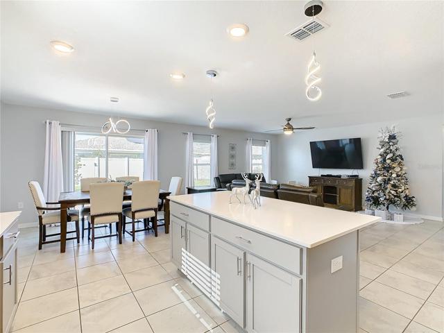 Dining Room, Kitchen Island, and Family Room View.