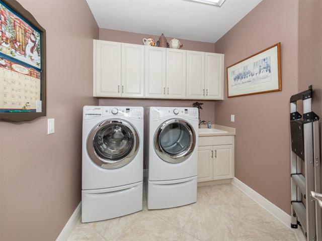 Laundry Room with Sink and Cabinets