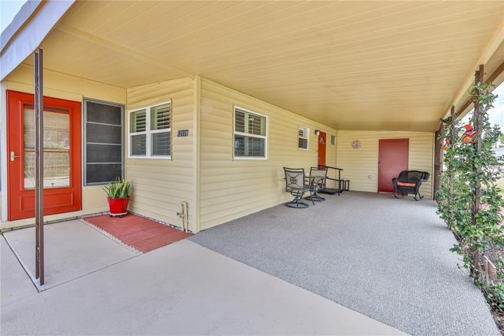 Carport entry into Lanai or side door entry with laundry room./shed in the back