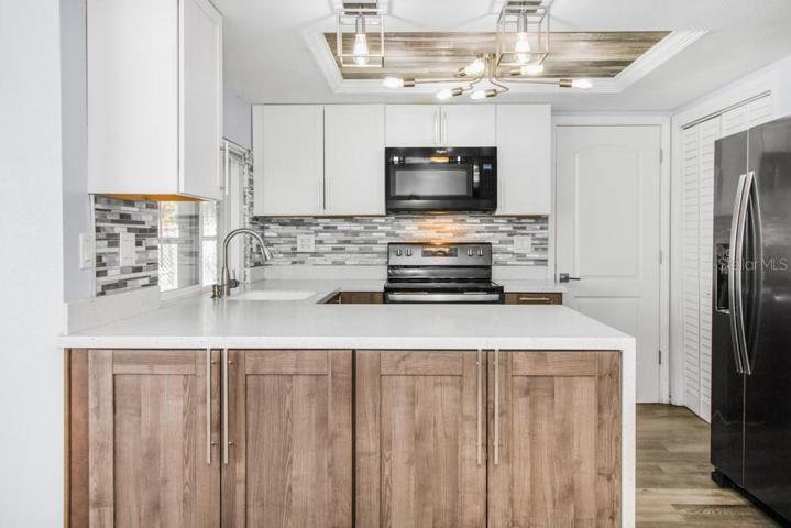 Updated Kitchen with Quartz countertops and Eat-In Space