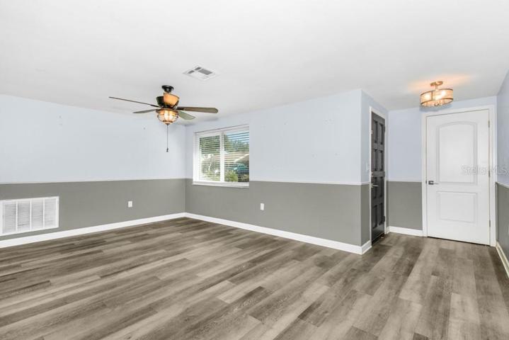 Living Room with a large storage/coat closet by front door
