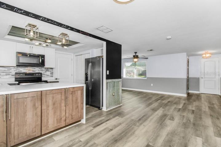 View from possible dinette area into kitchen and living room