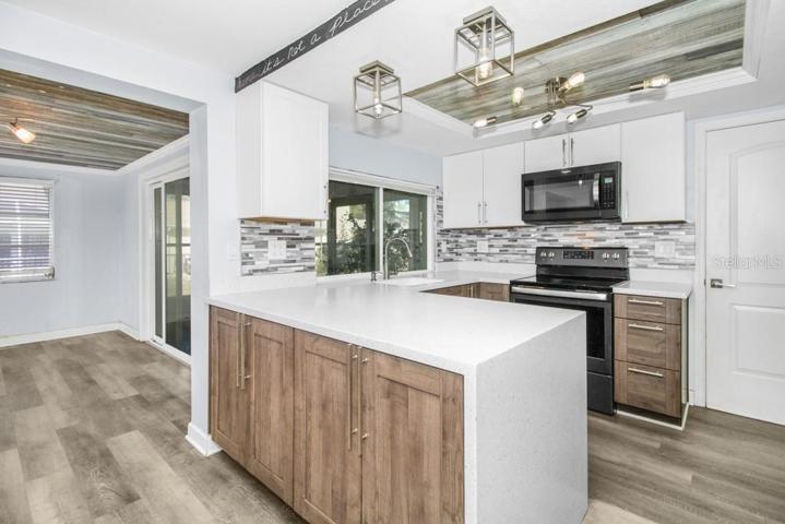 Updated Kitchen with Quartz countertops with Eat-In Space