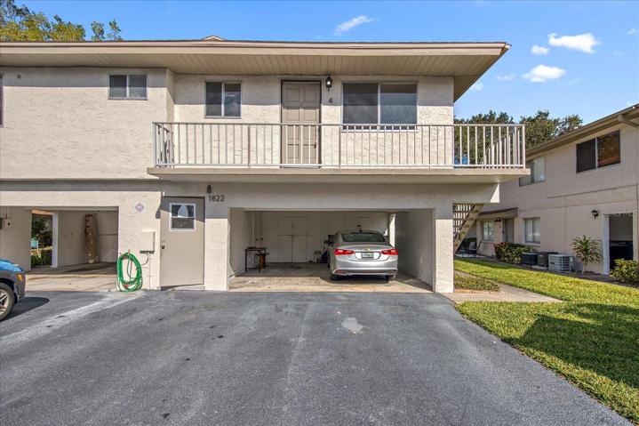 Front of unit with carport