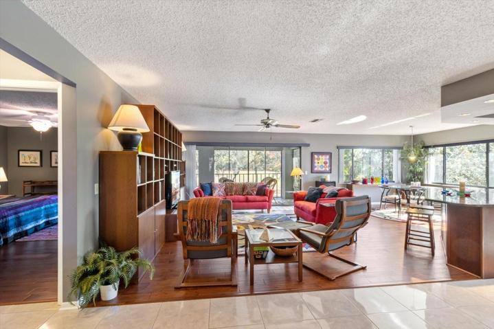 Living Room w/ 3 Panel Stacking Slider and Engineered Hardwood Flooring