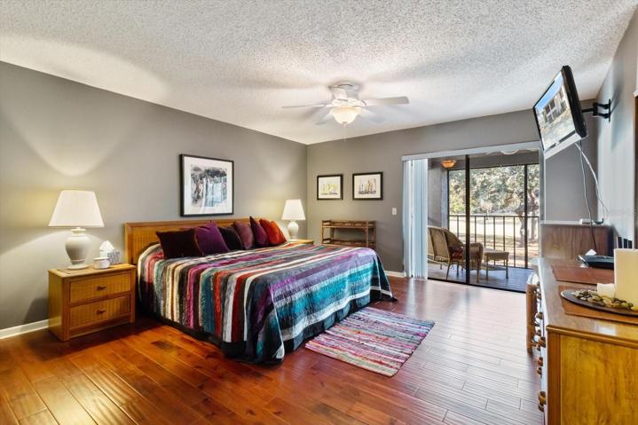 Master Bedroom w/ Engineered Hardwood Flooring, Slider to the Balcony, Walk in Closet & Ensuite
