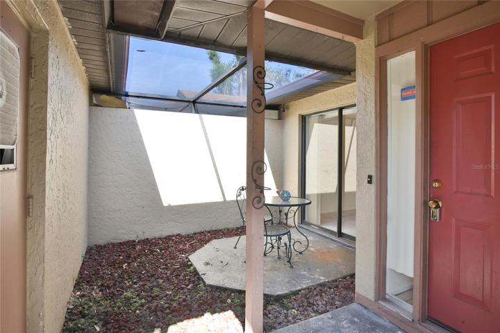Front Screen patio-to left is garage