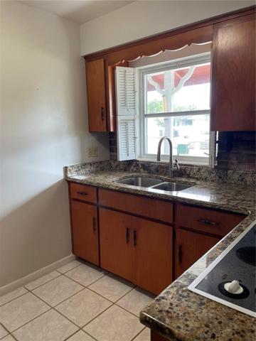 Solid pine cabinets and granite countertops.