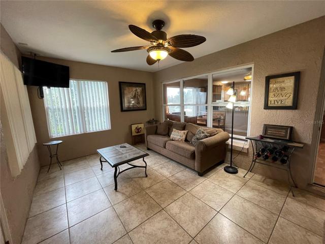 Den off the Dining/Kitchen area leads to the Back Covered Porch