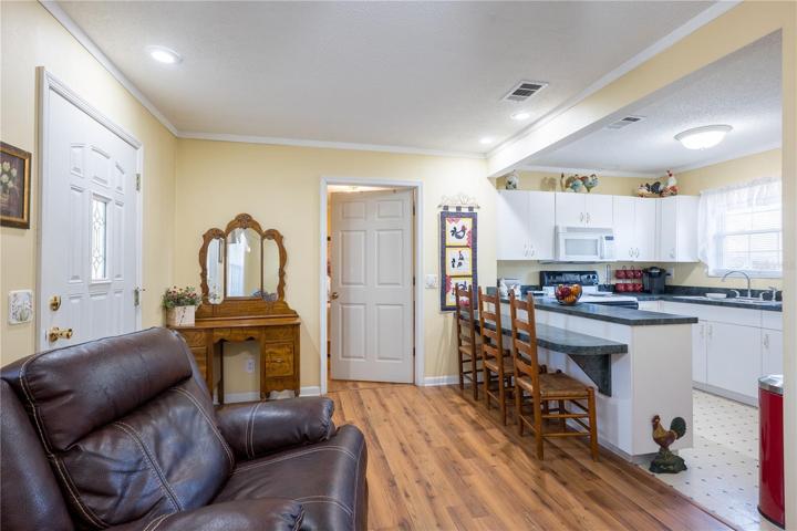 in-law suite living area with view of kitchen