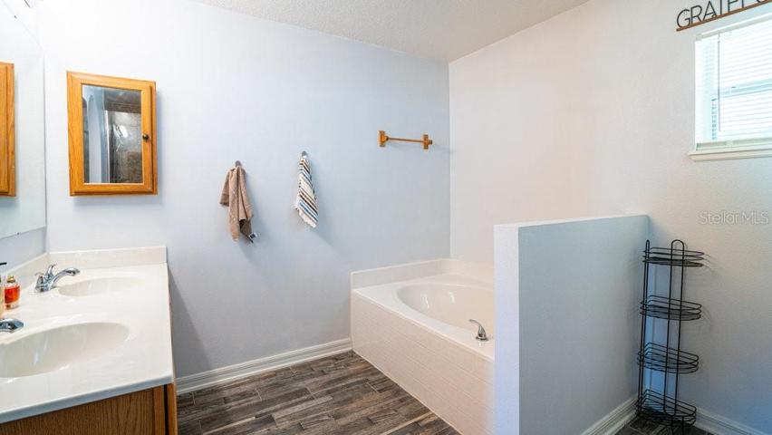 Primary en-suite bath with dual vanities and Garden tub
