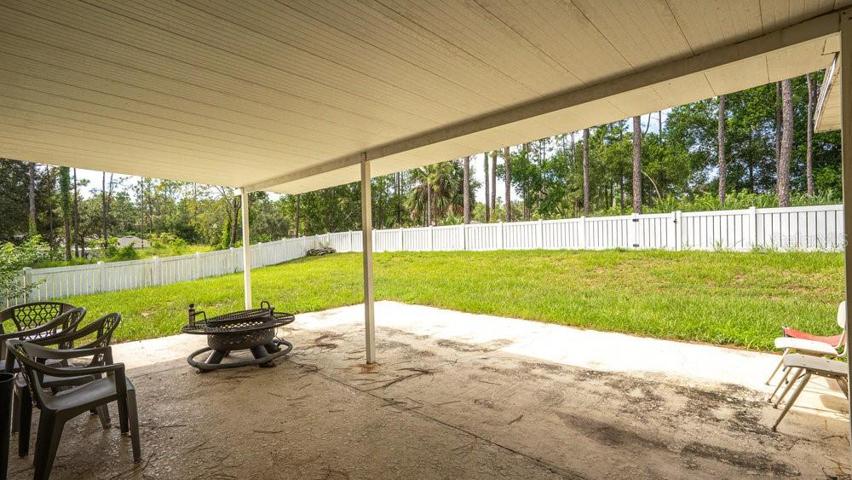 Huge covered back patio- fire pit stays