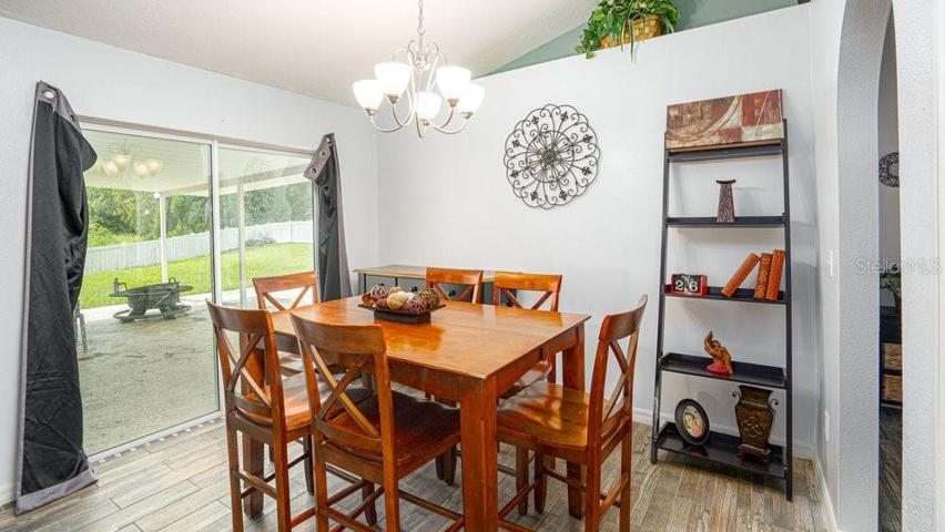 Dining area with views of covered back patio