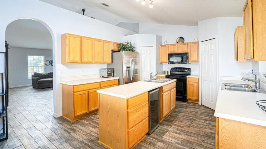 Kitchen and views of living room