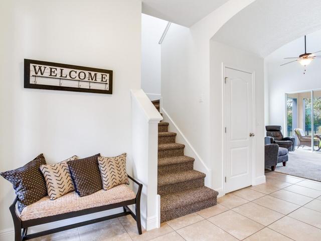 tiled foyer with storage closet