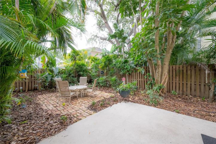 Privacy fenced yard with brick patio