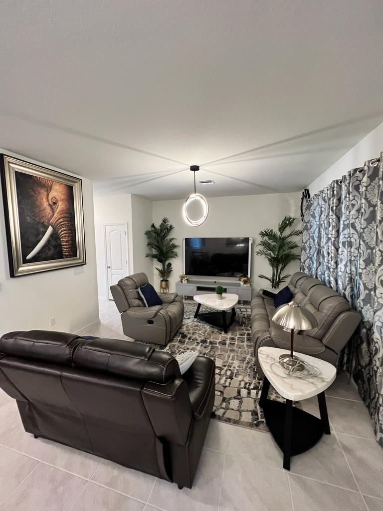 OPEN PLAN: LIVING ROOM FLOWS INTO DINING AND KITCHEN